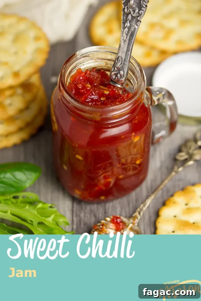 Homemade Sweet Chili Jam Recipe for Bold Flavor 9 A jar of sweet chilli jam with a knife in it