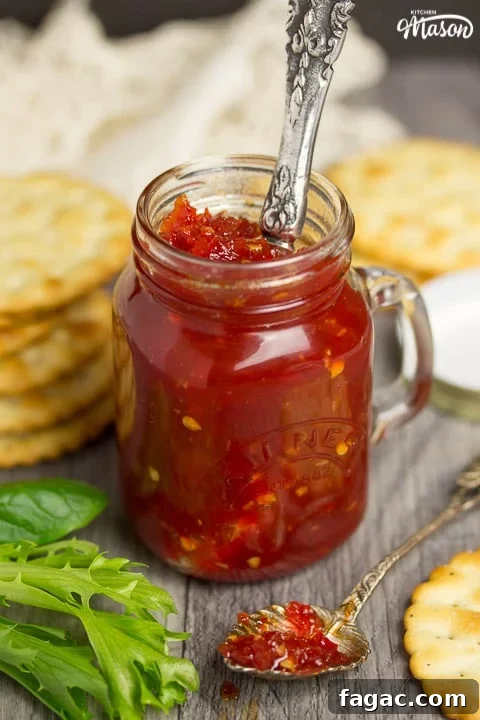 Homemade Sweet Chili Jam Recipe for Bold Flavor 4 sweet chilli jam in a kilner jar with crackers, lettuce and garlic cloves