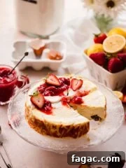 cottage cheese cheesecake on cake stand with strawberry jam and sour cream