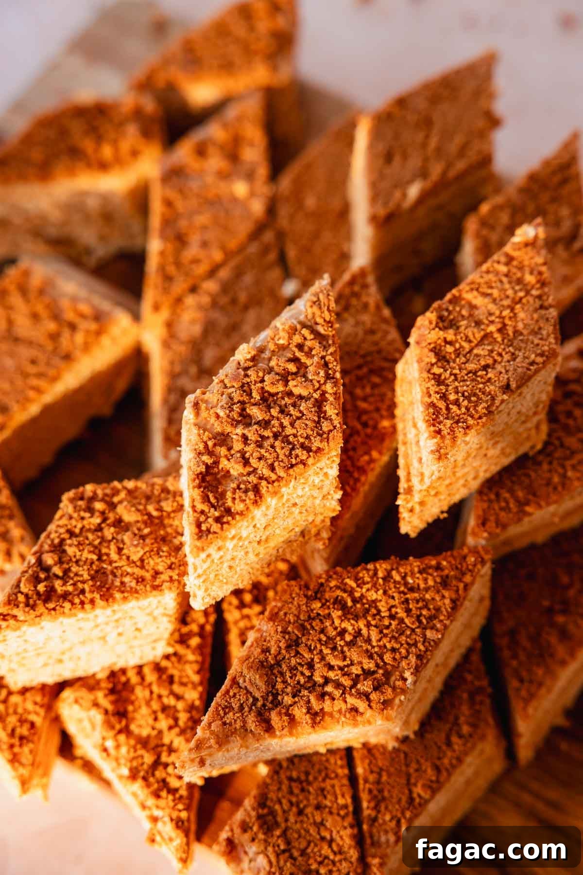 stacked pieces of caramel waffle cake on a cutting board