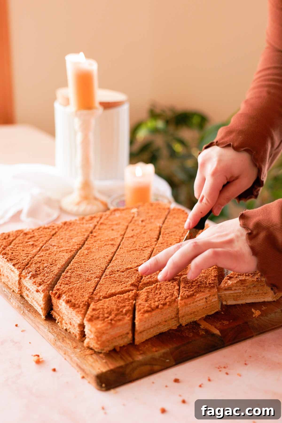 cutting dulce de leche waffle cake into diamond pieces
