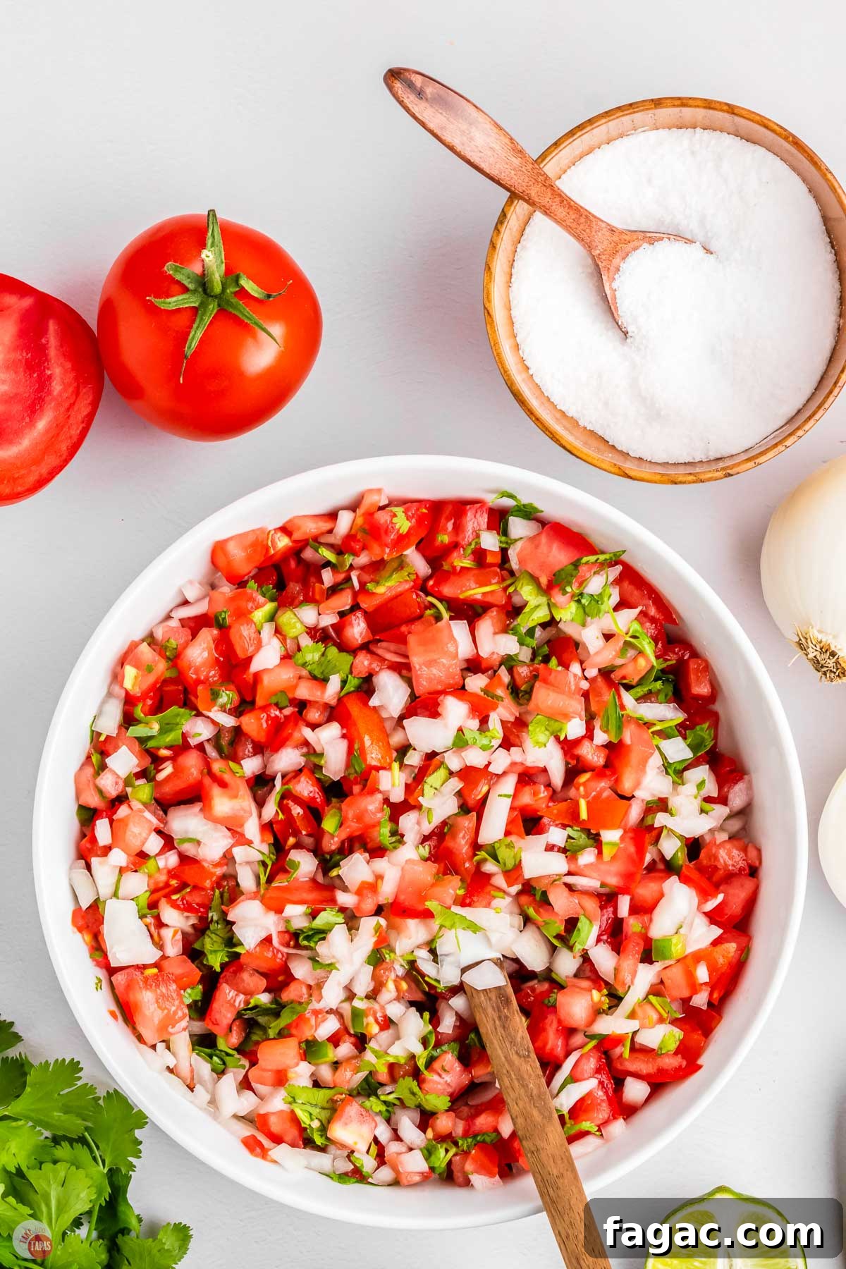 Fresh Homemade Pico de Gallo Recipe: Zesty Salsa in Minutes 8 fresh chopped pico de gallo in a bowl with a spatula