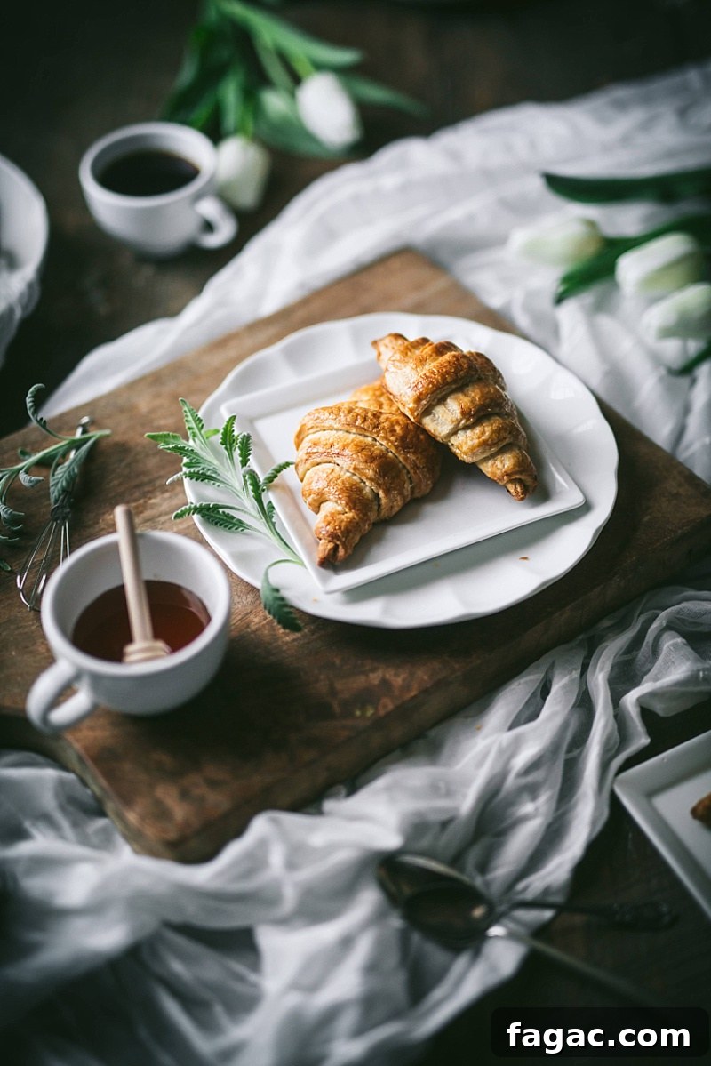 homemade puff pastry croissants on white and wood