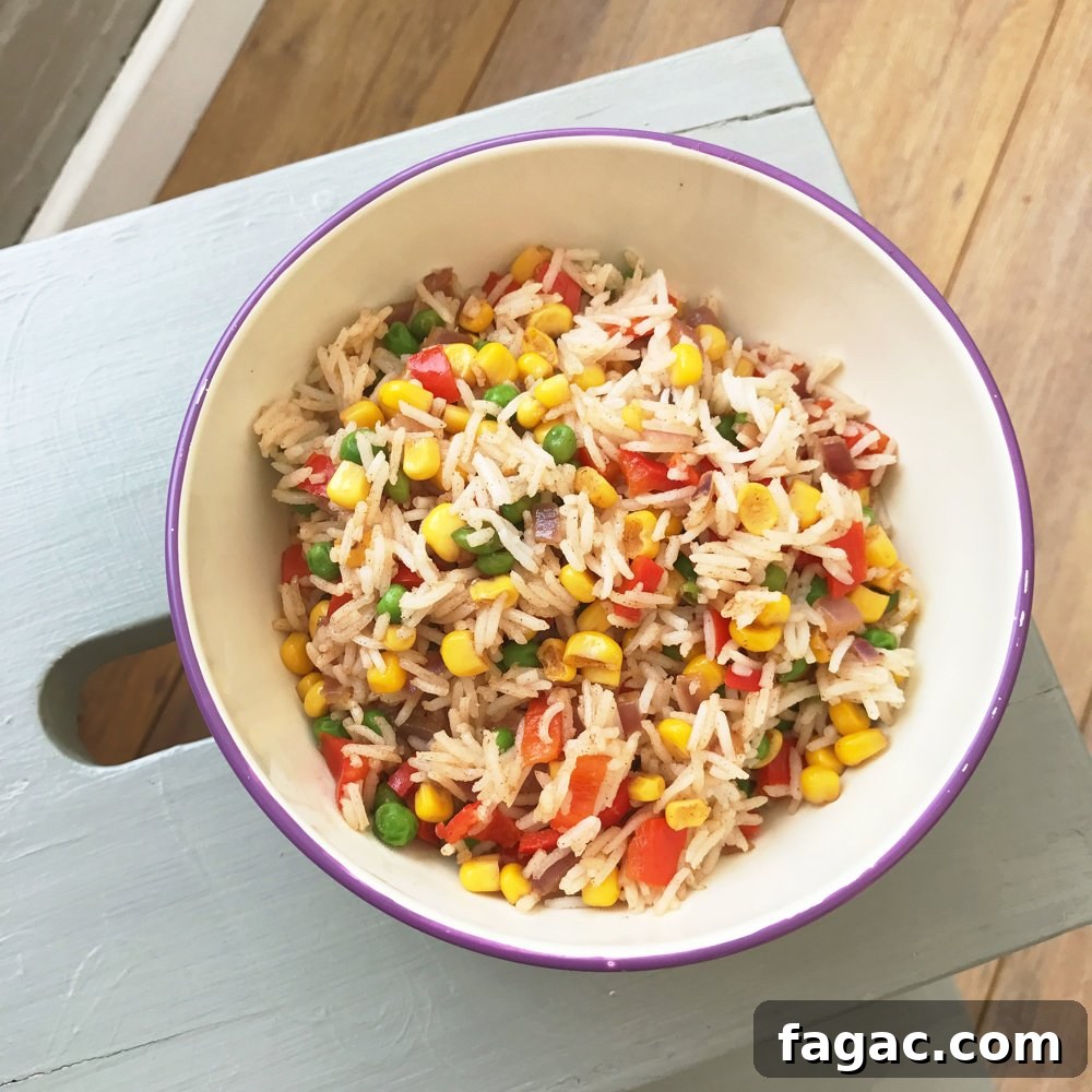 grey painted wooden IKEA footstool with white and purple enamel bowl on top filled with homemade veggie rice salad