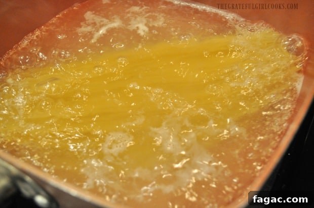 Cooking the spaghetti noodles Cooking the spaghetti noodles