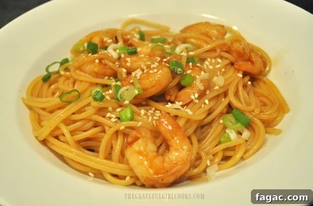 Served sweet chili shrimp pasta Served sweet chili shrimp pasta with sesame seeds and green onions