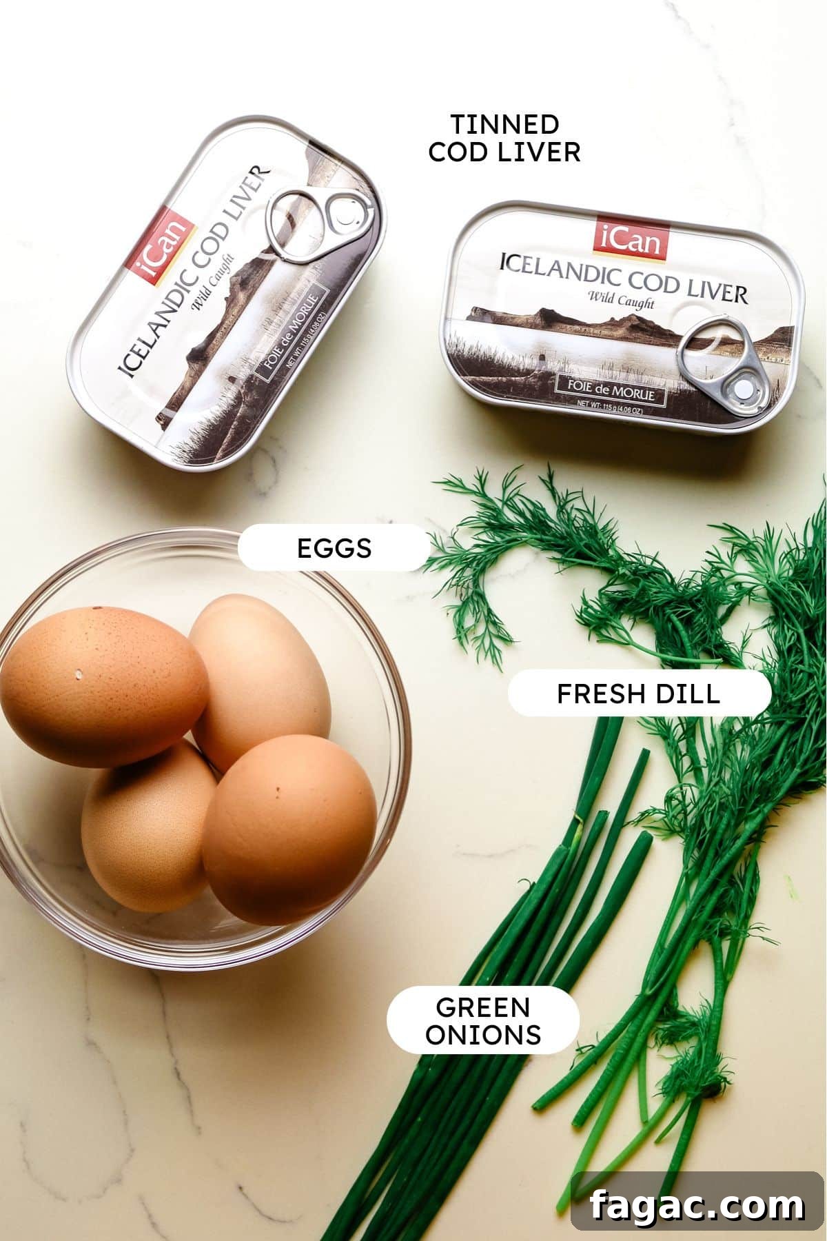Cod Liver and Egg Salad Recipe: Creamy, Tangy Seafood Salad 4 ingredients for cod liver salad including eggs, canned cod livers, dill, and green onions.