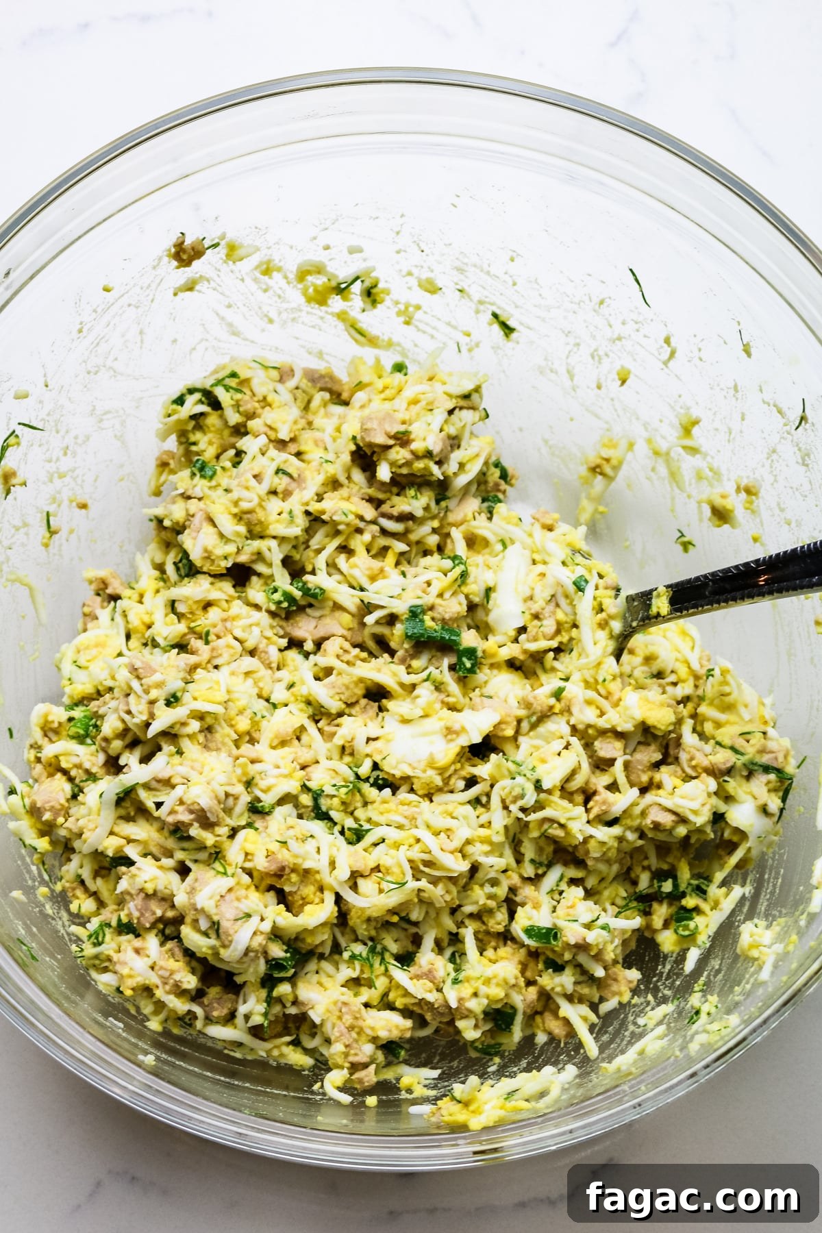 Cod Liver and Egg Salad Recipe: Creamy, Tangy Seafood Salad 10 cod liver salad recipe mixed in a clear bowl.