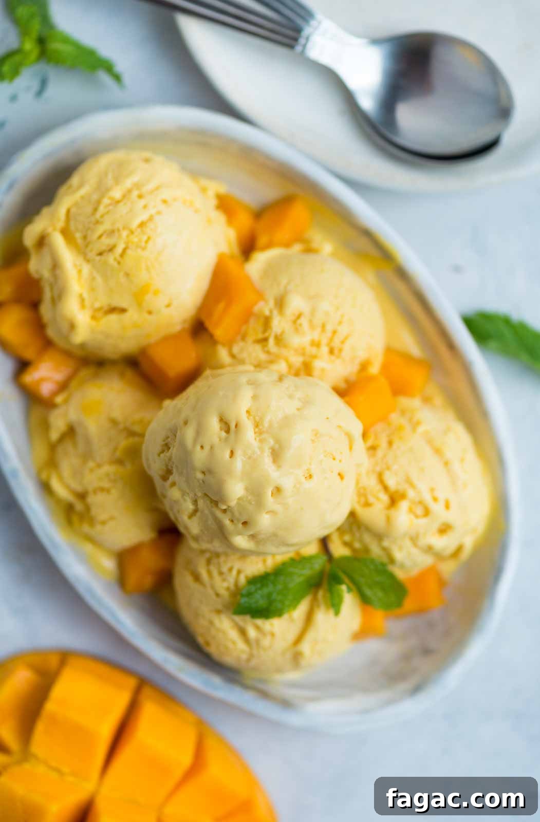 Whipping cream and folding in mango mixture makes the ice cream fluffy.