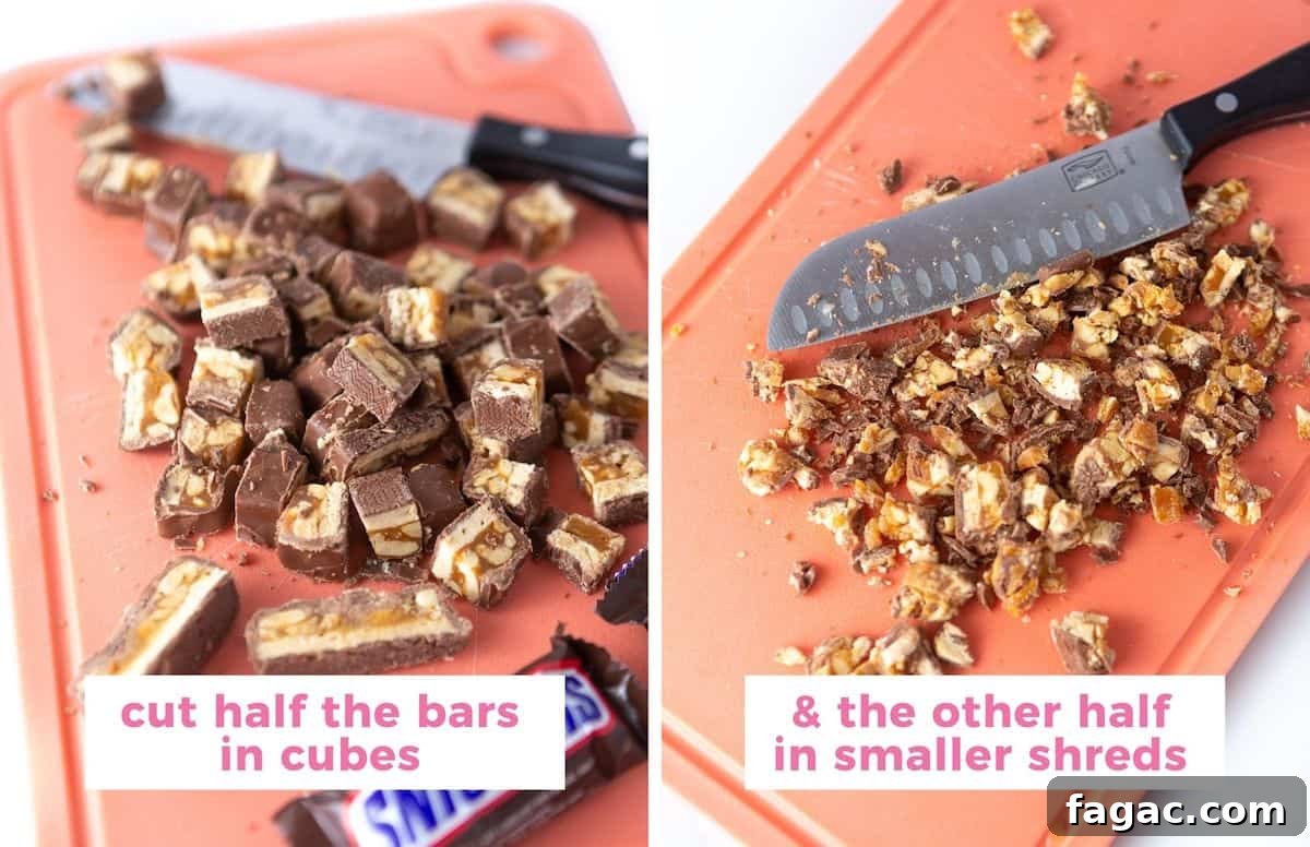 Apple Snickers Salad Recipe: Crunchy Caramel Apple Dessert Salad 5 Cutting board chopping snickers candy bars with text overlay stating to cut half the bars in cubes, while cutting the other half into smaller shreds