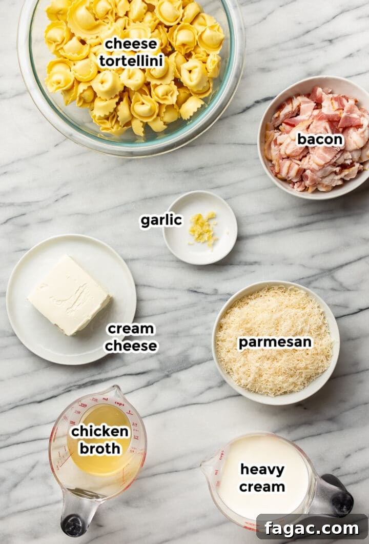 ingredients for bacon cream cheese tortellini in prep bowls and measuring cups