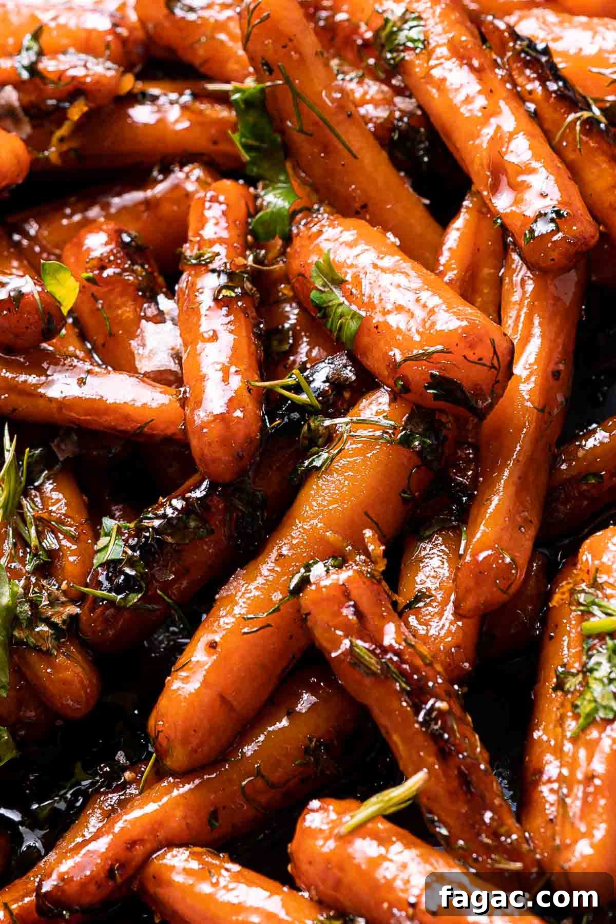 Honey-Glazed Orange Carrots with Citrus Butter Glaze 2 honey orange glazed carrots with herb garnish