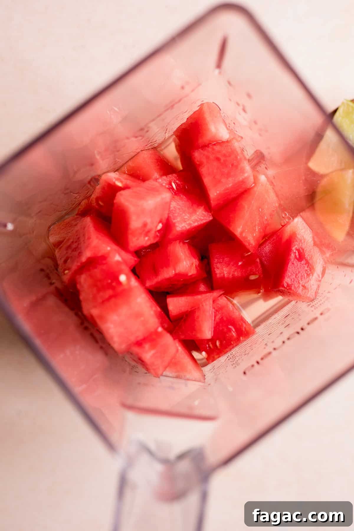Watermelon Margarita Recipe: Refreshing Summer Cocktail Guide 4 Watermelon added to a blender.