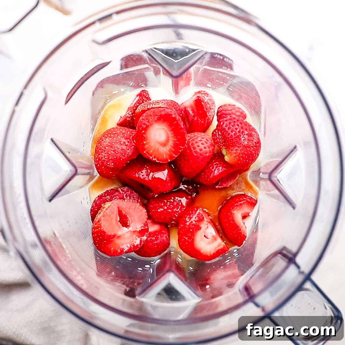 Creamy Strawberry Raspberry Smoothie Recipe for Spring Refreshment 5 ingredients to make smoothie added to a blender