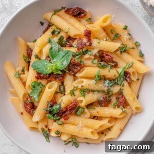 Sun-Dried Tomato Pasta with Garlic, Basil & Parmesan 13 Sun dried tomato pasta with fresh basil and parmesan cheese.