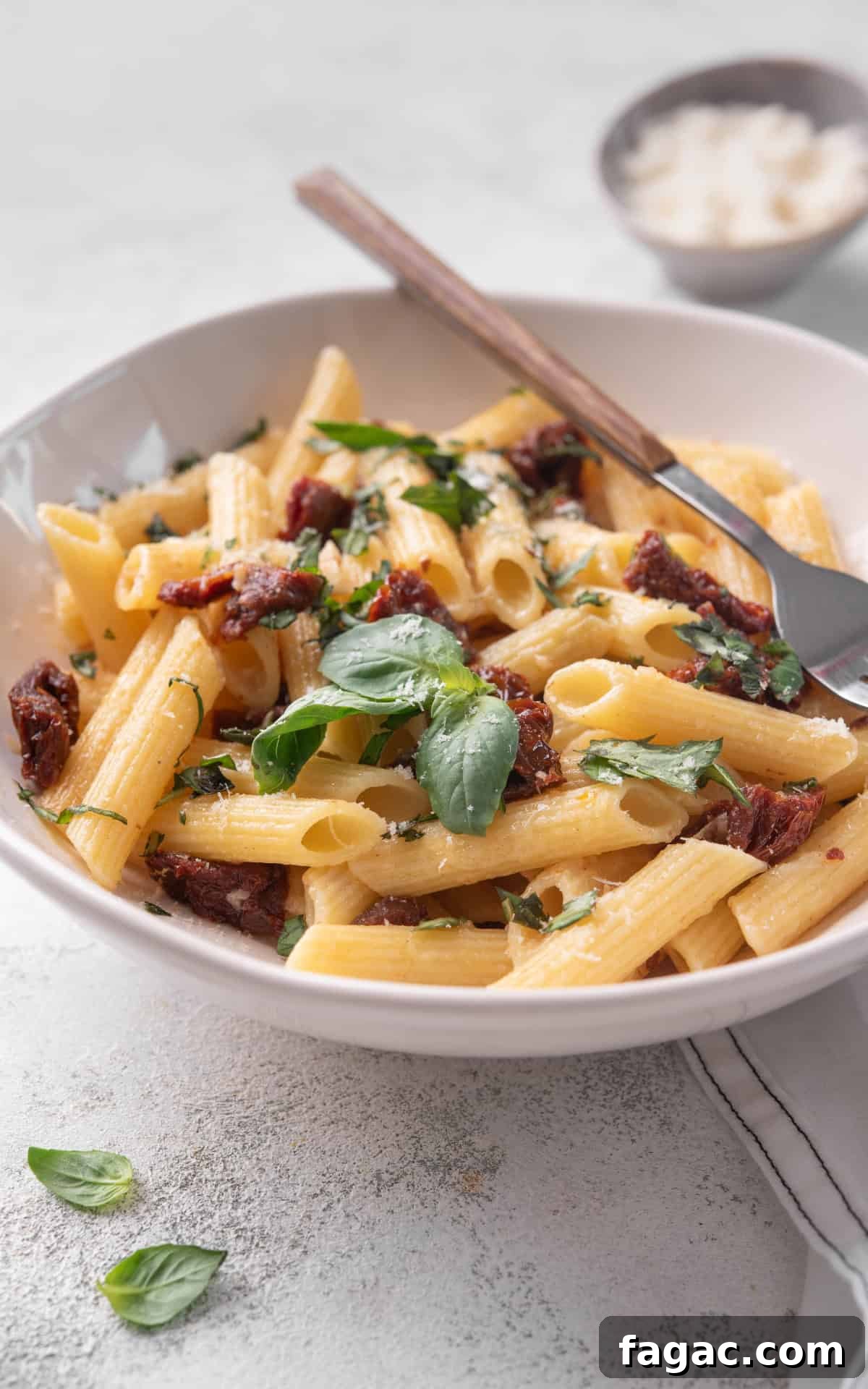 Sun-Dried Tomato Pasta with Garlic, Basil & Parmesan 8 pasta with sun dried tomatoes, parmesan and fresh basil.