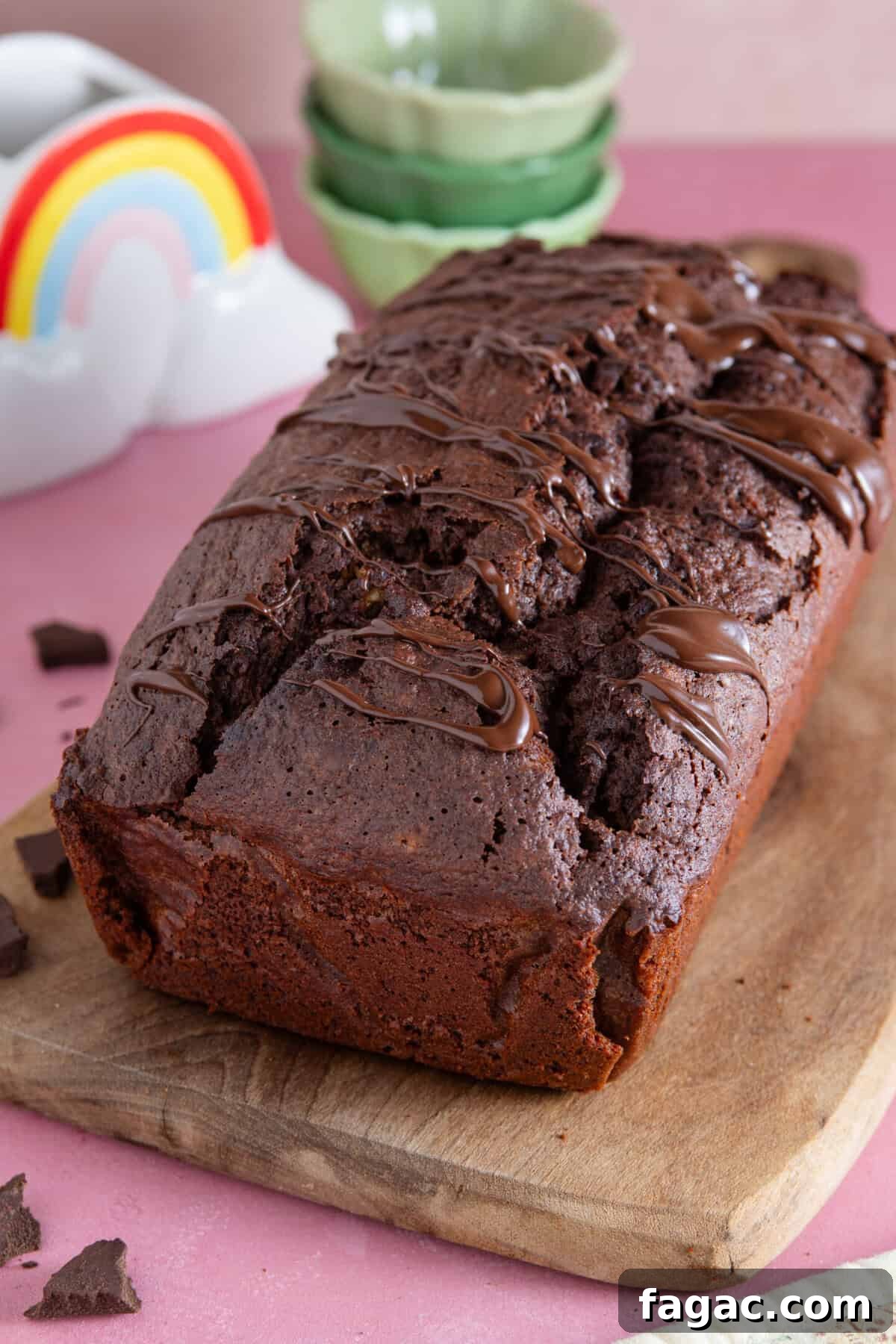 Moist Chocolate Zucchini Cake Recipe 10 A gluten free courgette cake on a wooden board.