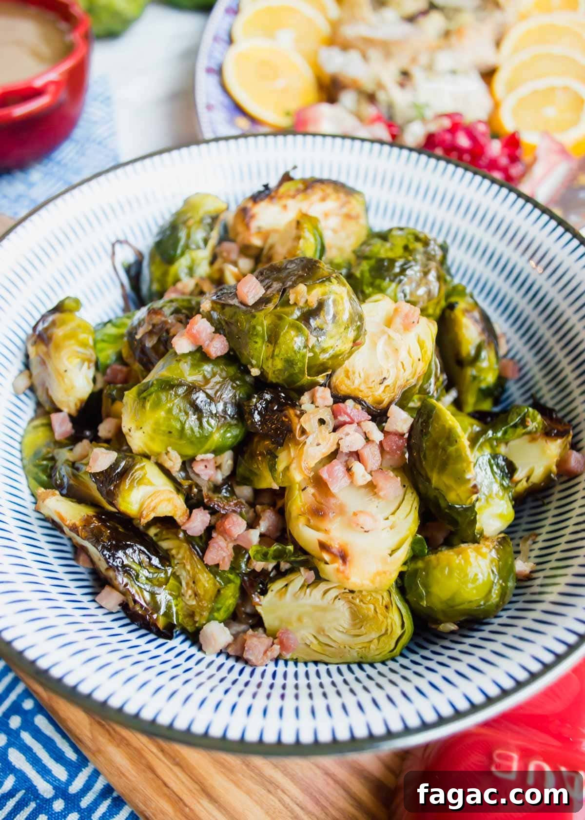 20 Tasty Sides to Serve with Burgers (Healthy Options Included) 14 Maple Brussel Sprouts with Pancetta in bowl flatlay.