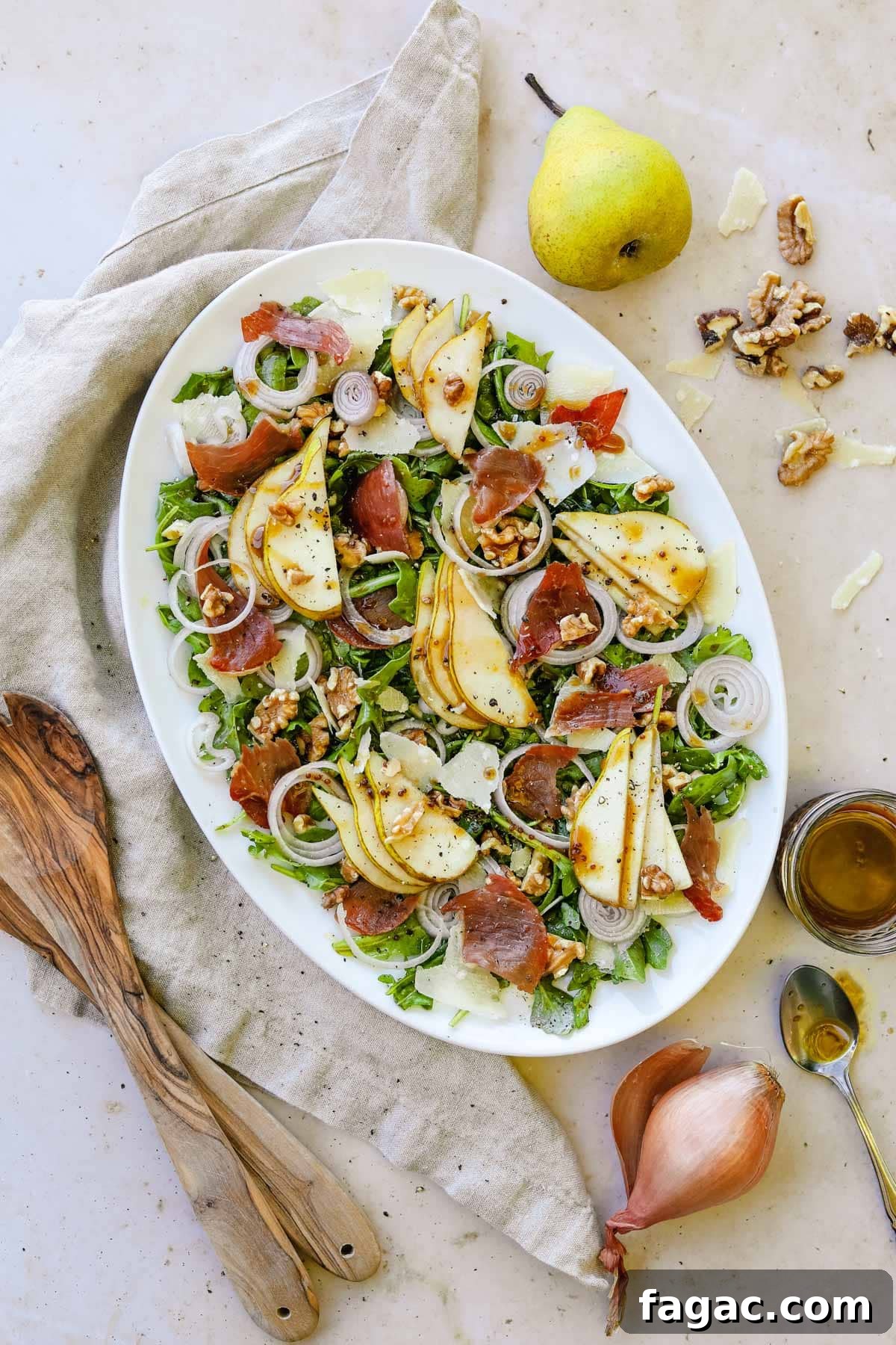 20 Tasty Sides to Serve with Burgers (Healthy Options Included) 15 Pear and prosciutto rocket salad on a serving platter with sliced pears, crispy prosciutto, shallots, walnuts, arugula, and a maple balsamic vinaigrette vinaigrette.
