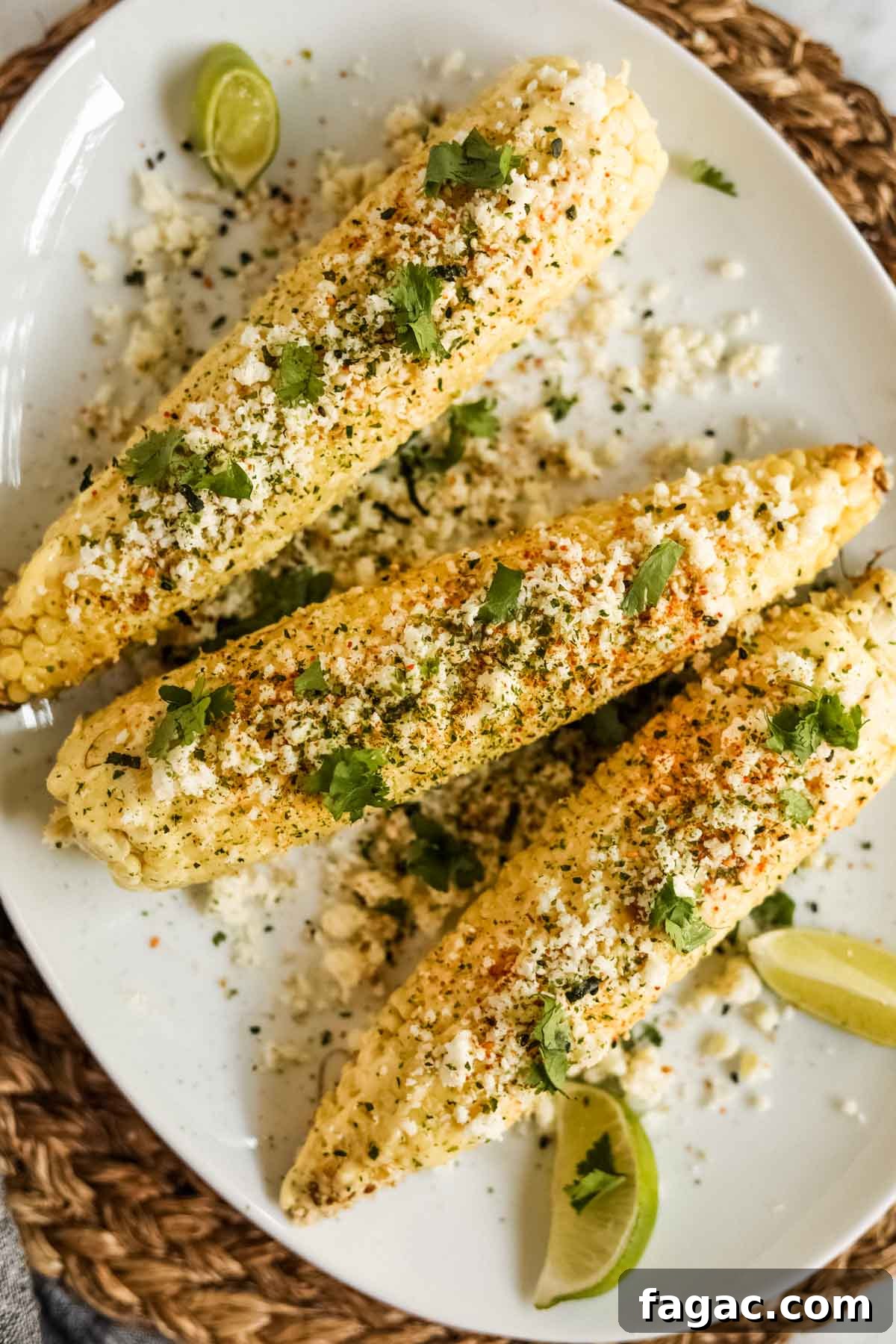 20 Tasty Sides to Serve with Burgers (Healthy Options Included) 3 Elote-style corn with furikake and kewpie mayo on a plate flatlay.