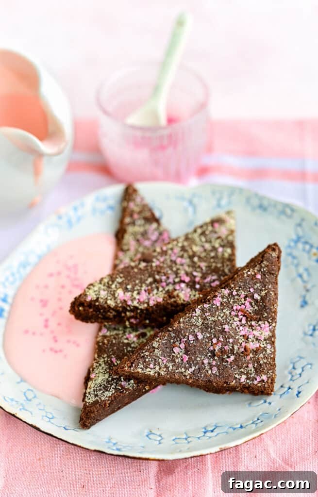 Chocolate concrete cut into triangles and served with pink custard