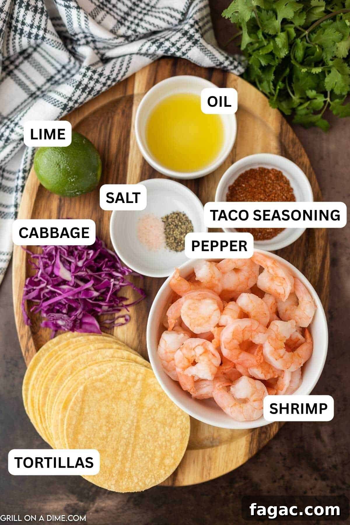 Ingredients needed to make this recipe which includes shrimp, taco seasoning, lime, vegetable oil, salt and pepper, corn tortillas, red cabbage and cojita cheese.