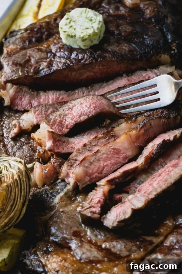 How to Grill a Tender, Flavorful Steak Every Time 2 Sliced grilled ribeye steak.