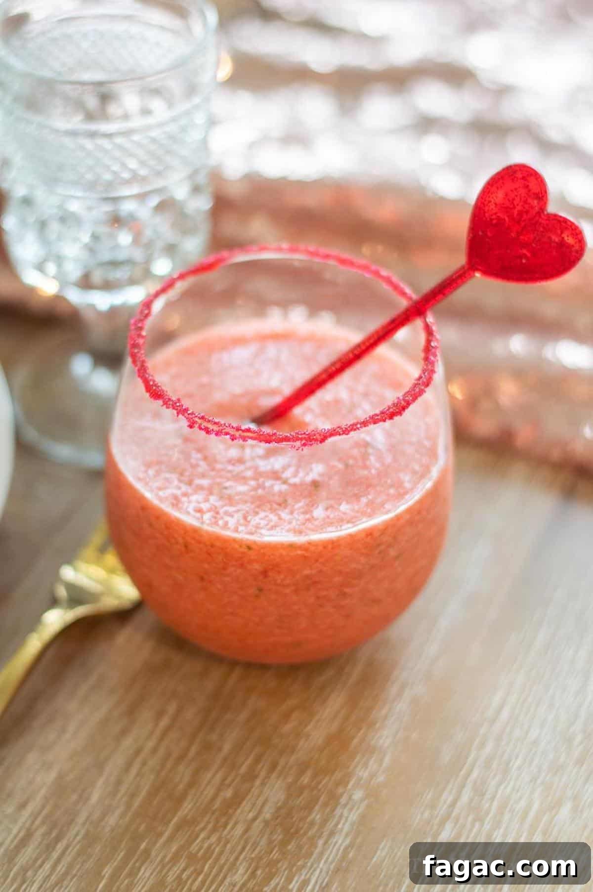 Virgin Strawberry Margarita Mocktail in a cup with red sugar rim