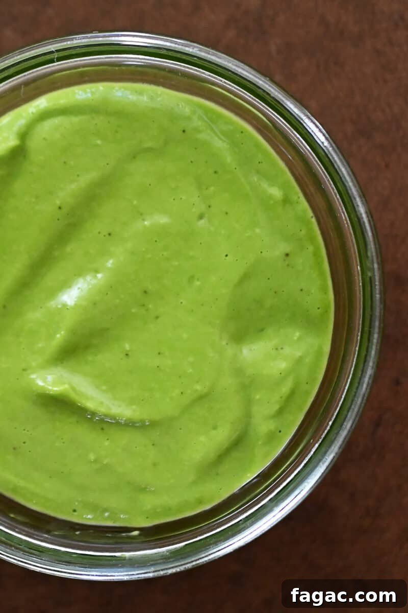 An overhead shot of a jar of Whole30 and vegan Green Goddess Dressing.