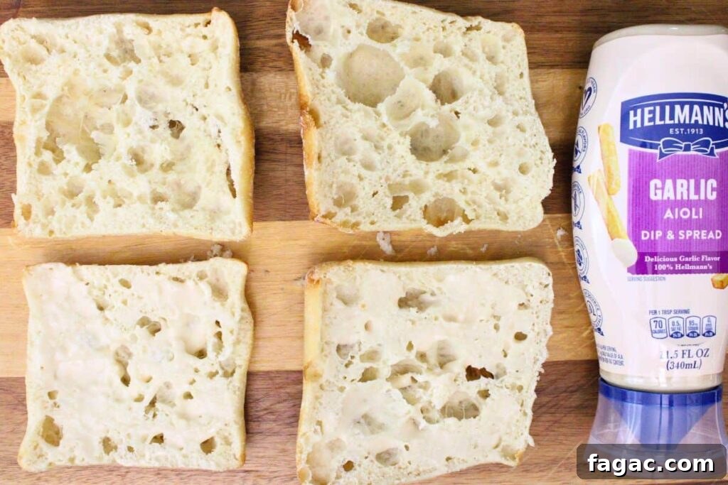 spread garlic aioli over the bottom half of ciabatta