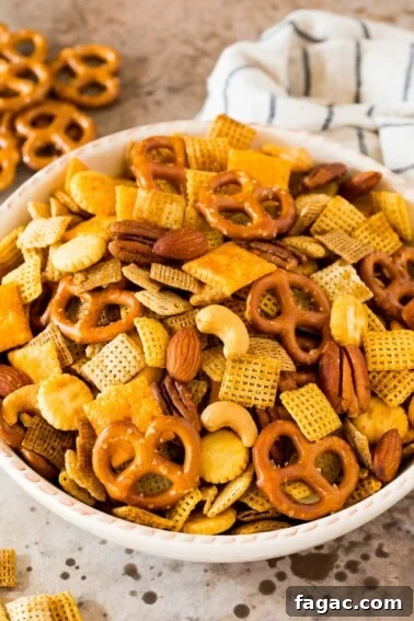 Creamy Buffalo Ranch Chicken Dip Recipe for Game Day 5 Chex mix in a white serving bowl.