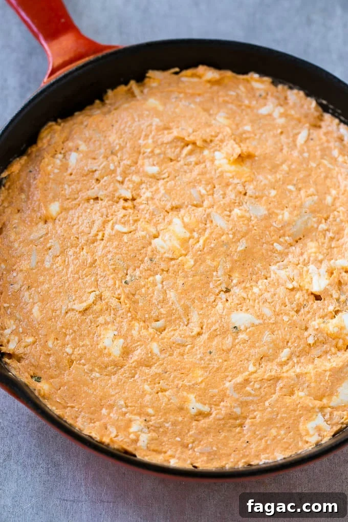 Buffalo Ranch Chicken Dip The base layer of cream cheese, meat, ranch and hot sauce.