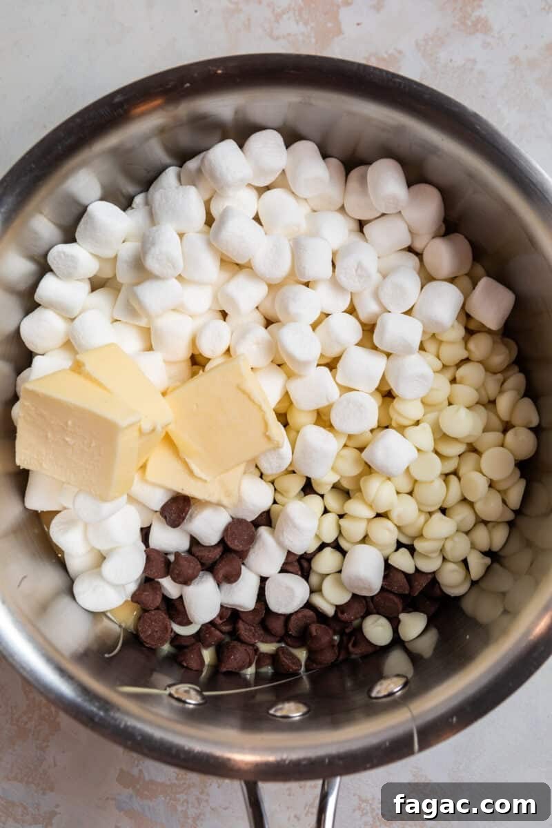 Decadent Red Velvet Oreo Fudge Recipe for Dessert Lovers 4 Marshmallows, butter, chocolate chips and sweetened condensed milk in sauce pan.