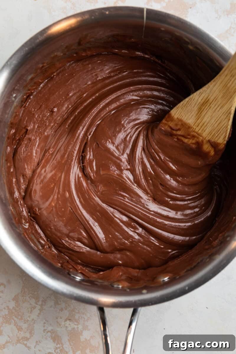 Decadent Red Velvet Oreo Fudge Recipe for Dessert Lovers 5 Fudge melted in saucepan.