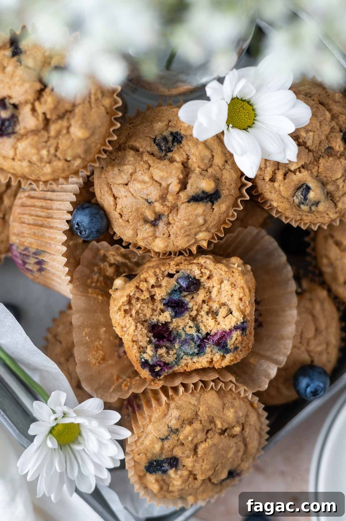 muffins in a pan with fresh flowers