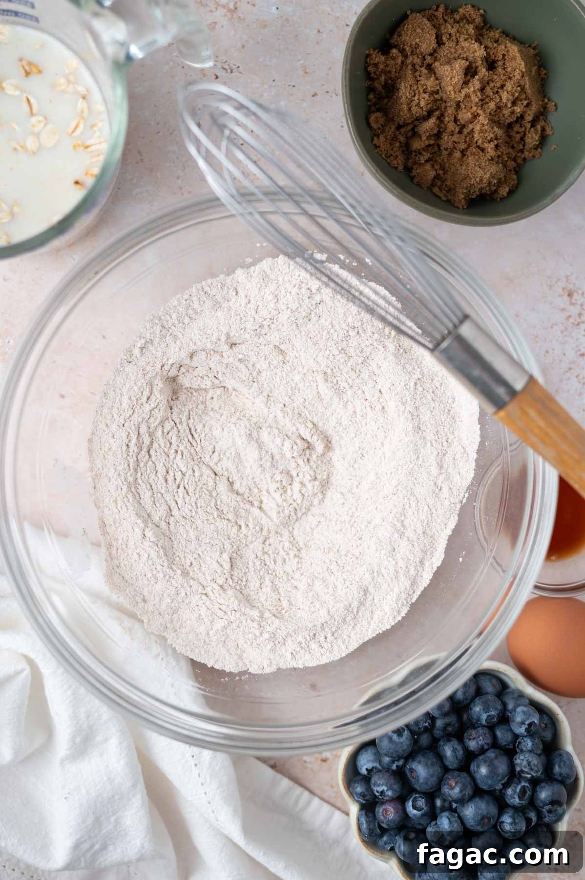 flours and leavening ingredients in a bowl with a whisk