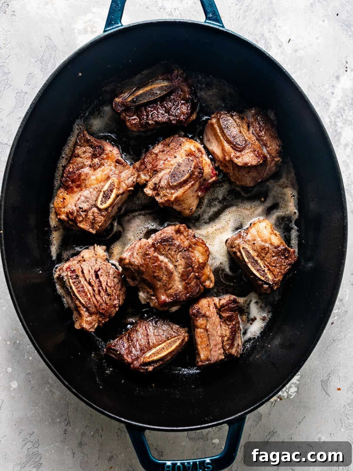 seared short ribs in a large pot.