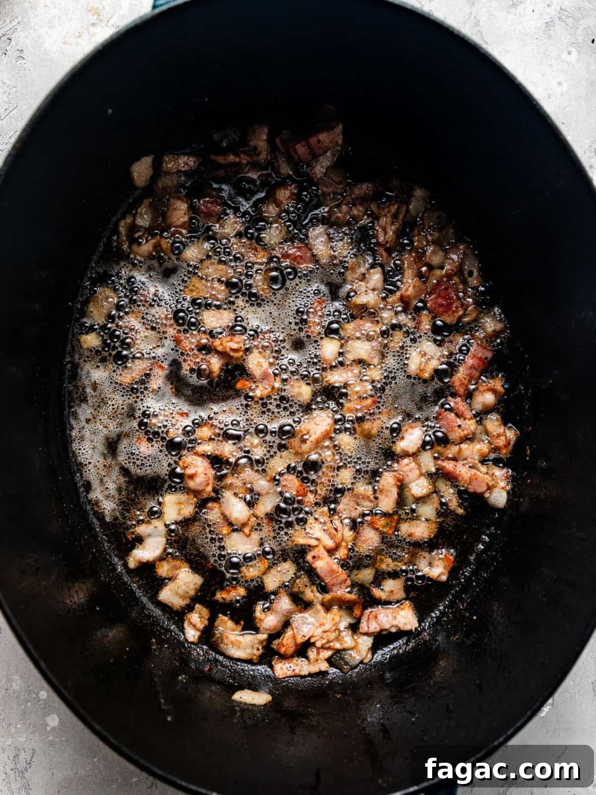 bacon cooked in a large pot.