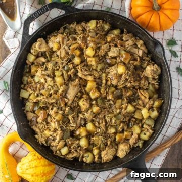 close-up of turkey hash on white plate with gravy