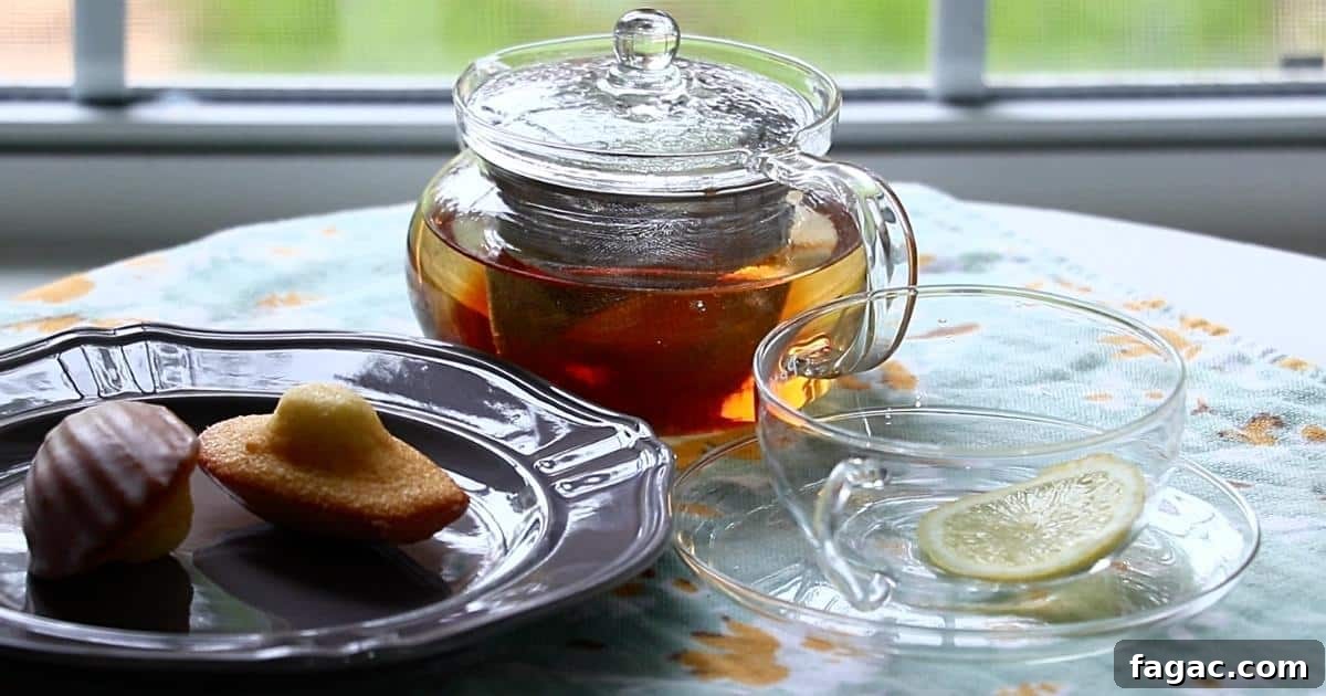 2 lemon madeleines with a tea on a table
