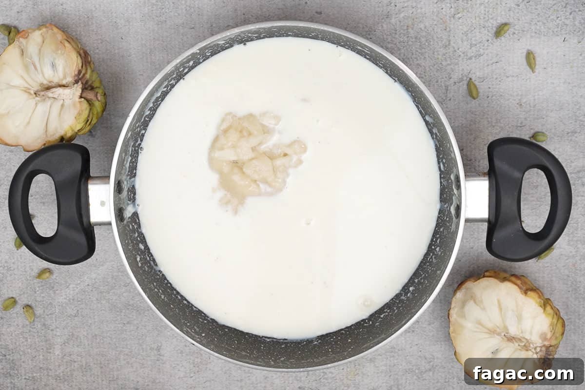 Custard apple pulp added to cooled basundi.