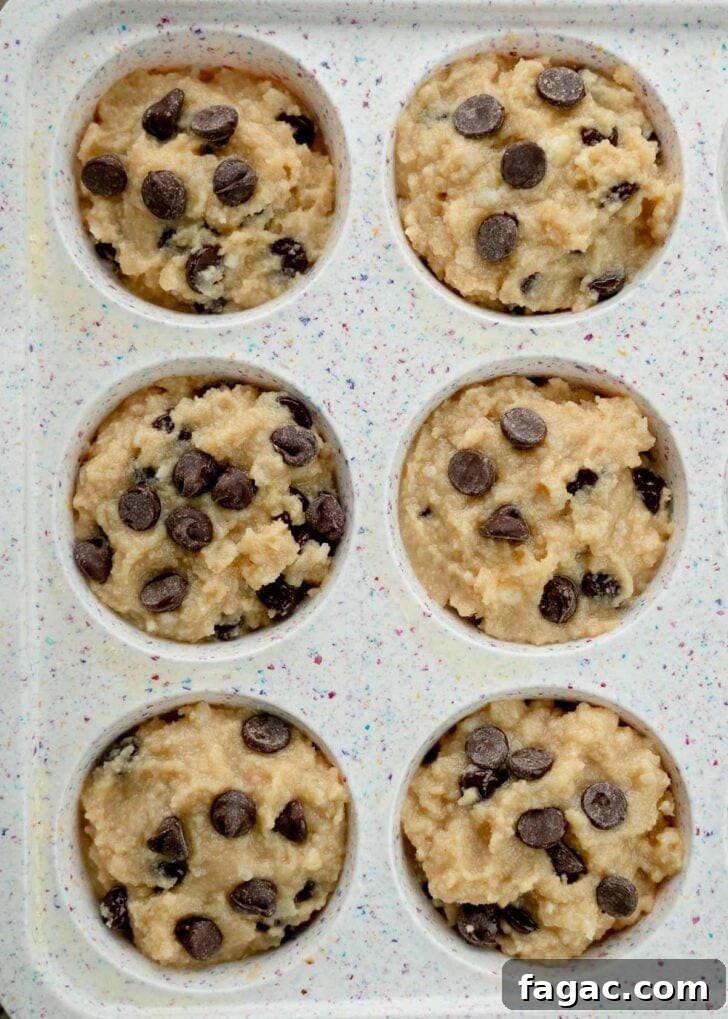 Coconut Flour Muffins: Moist, Low-Carb Recipe for Beginners 13 keto coconut flour muffin batter spooned into muffin pan