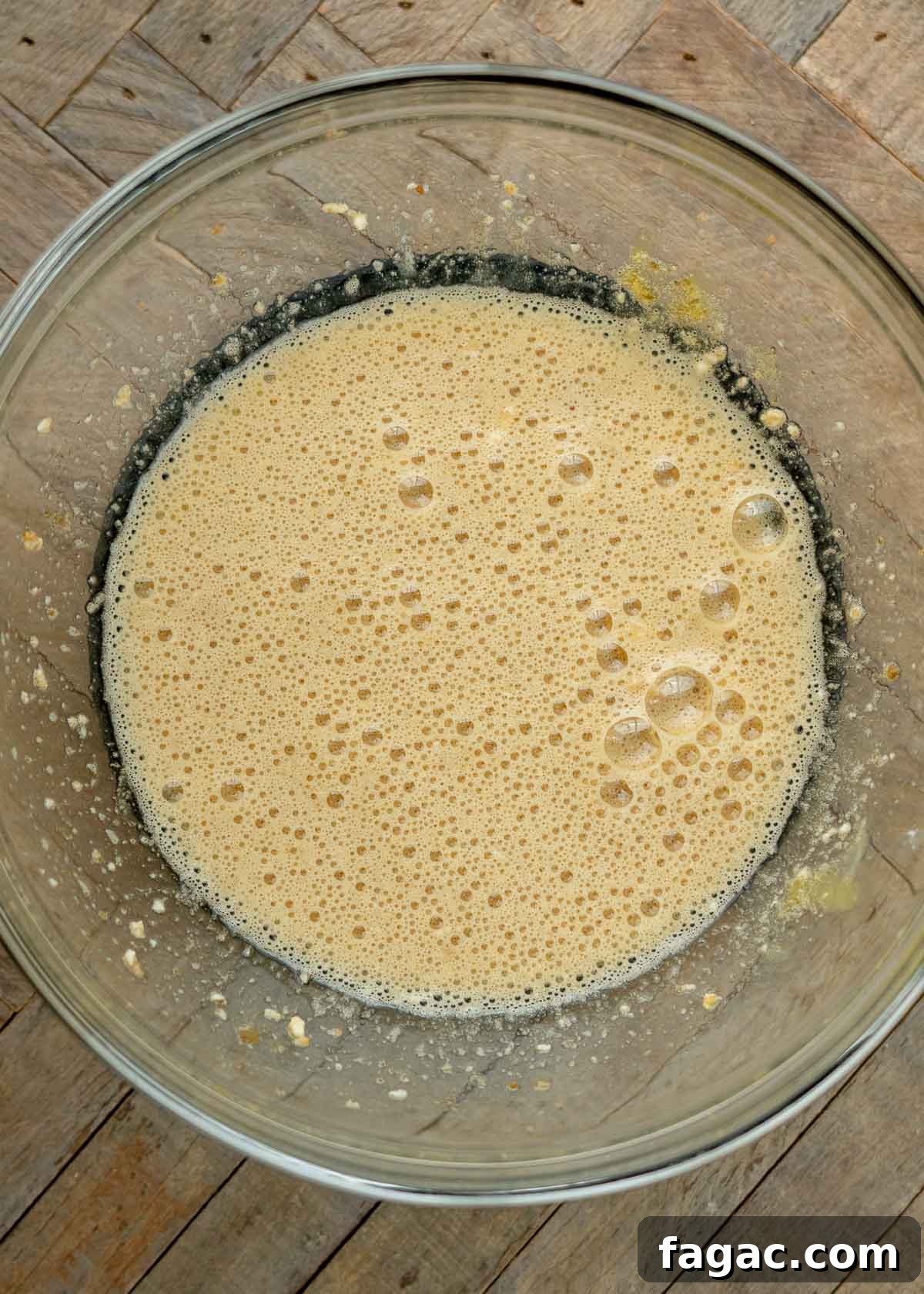 Coconut Flour Muffins: Moist, Low-Carb Recipe for Beginners 5 wet ingredients for coconut flour muffins mixed in a glass bowl