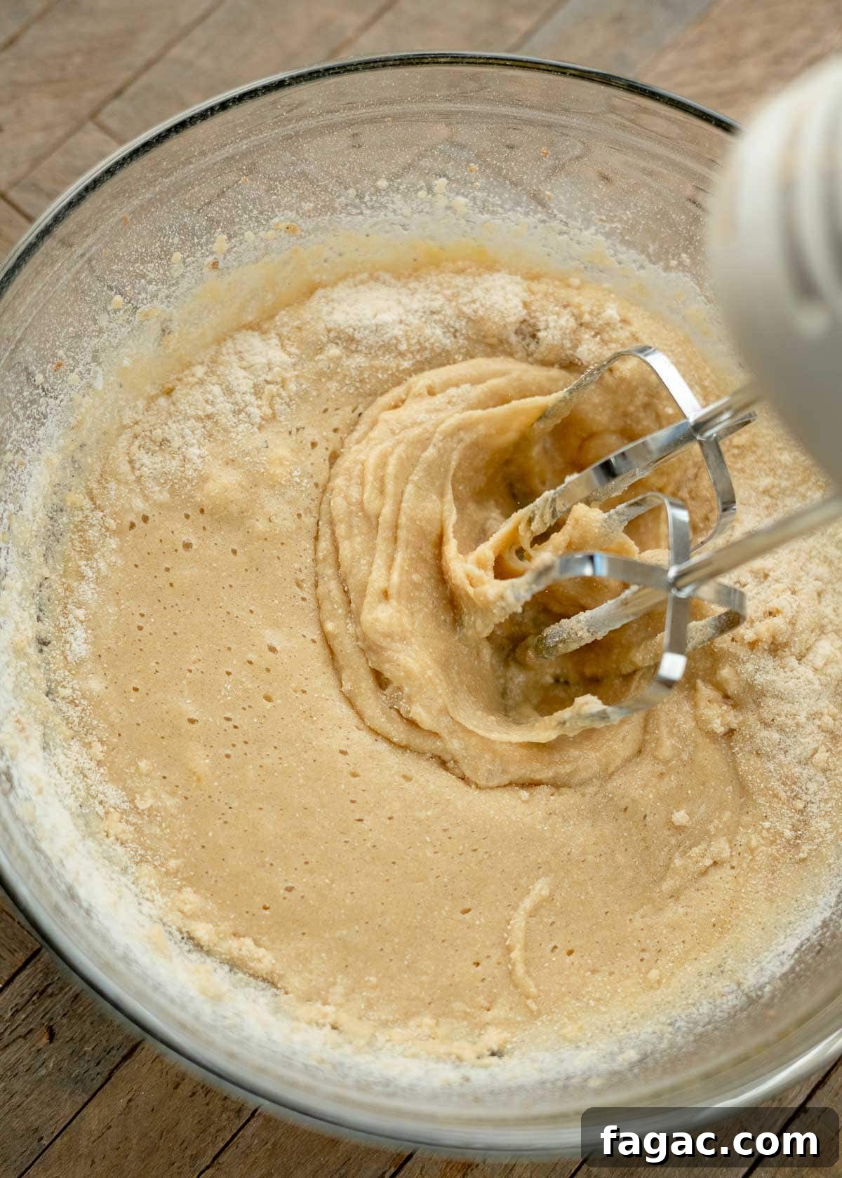 Coconut Flour Muffins: Moist, Low-Carb Recipe for Beginners 8 coconut flour muffin batter being mixed with an electric mixer