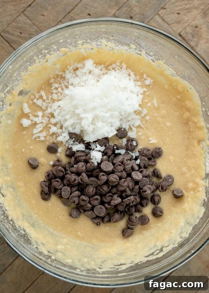 Coconut Flour Muffins: Moist, Low-Carb Recipe for Beginners 9 coconut flakes and chocolate chips in a keto muffin batter