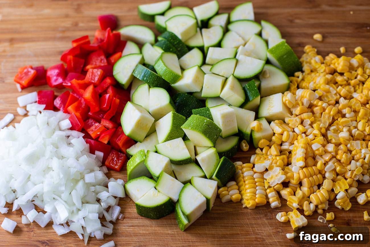 Instant Pot 15-Bean Summer Vegetable Soup Recipe 5 chopped vegetables on a cutting board
