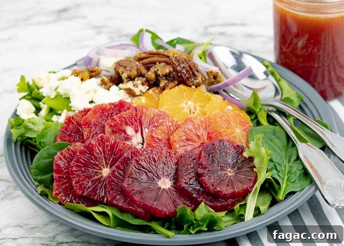 Blood Orange Salad with Tangy Orange Vinaigrette 3 Blood Orange Citrus Salad with Orange Vinaigrette on a gray plate