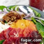 Blood Orange Salad with Tangy Orange Vinaigrette 8 Blood Orange Citrus Salad with Orange Vinaigrette on a gray plate