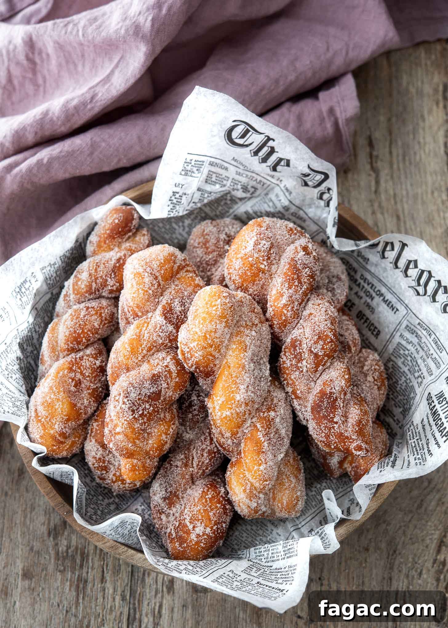Korean Kkwabaegi Twisted Donuts Recipe: Soft Cinnamon Treats 2 Freshly fried Korean twisted donuts (kkwabaegi) served in a bowl