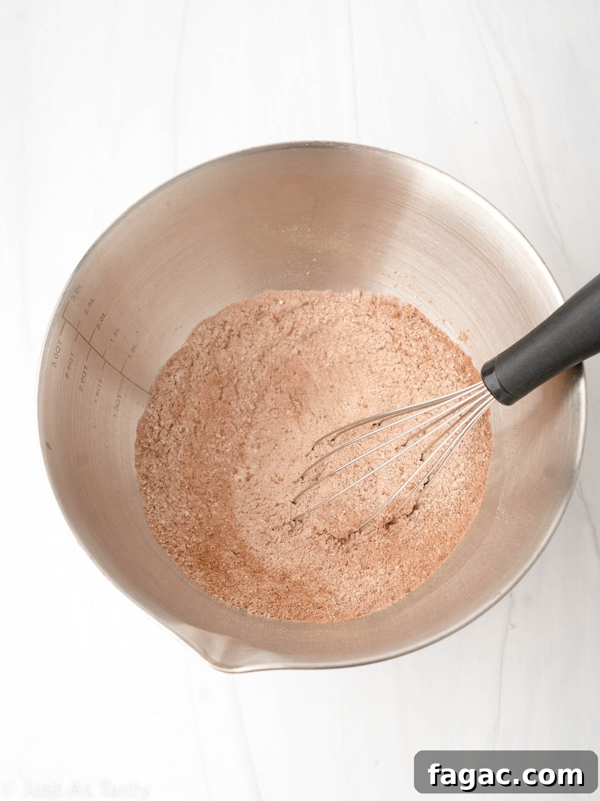 Gluten-Free Red Velvet Cake Recipe — Moist, Classic Flavor 5 Dry ingredients with a whisk in a mixing bowl.